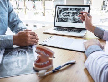 dentist showing patient x rays in Orlando