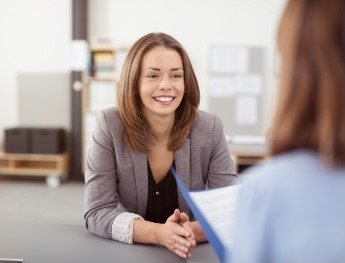 patient smiling at receptionist in Orlando